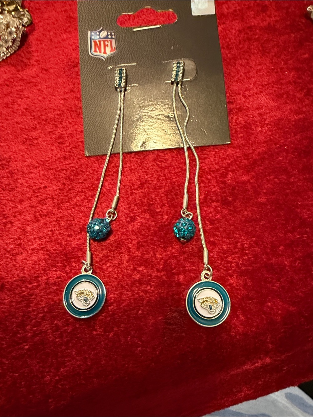 NFL Jacksonville Jaguars Teal Dangle Earrings new never worn in package